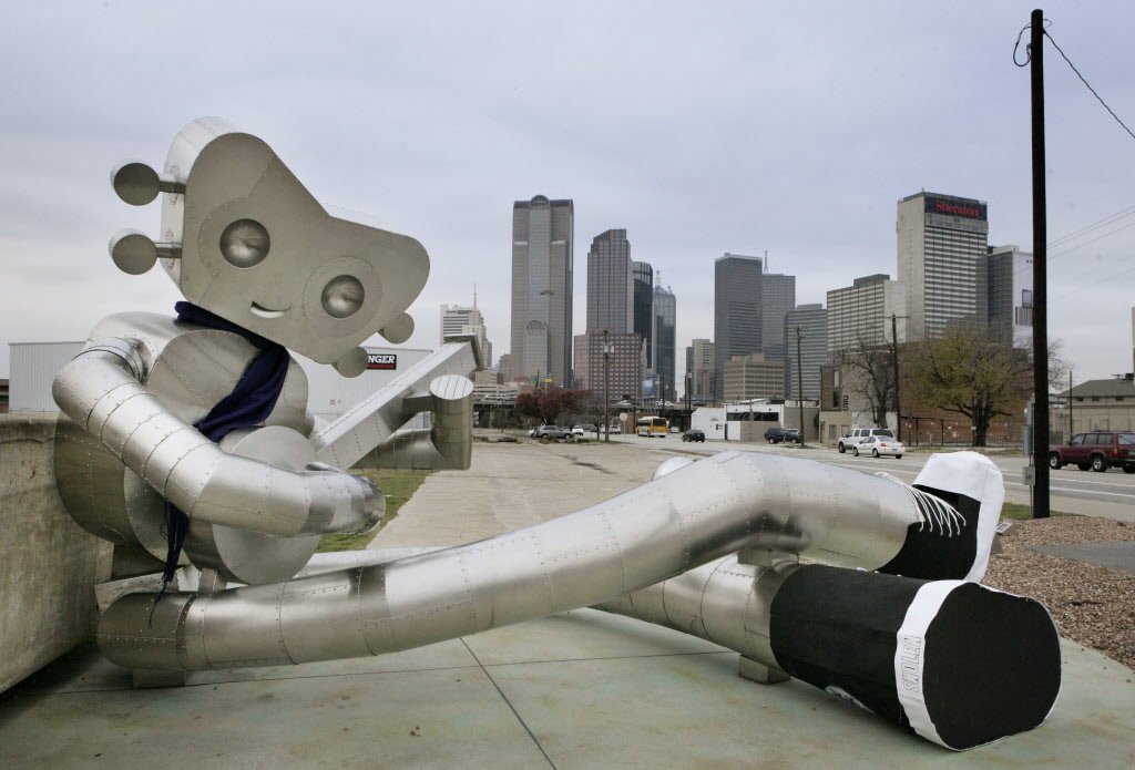 The Traveling Man sculpture at Gaston and Good Latimer, one of a series of three in the Deep Ellum district. Photo courtesy of the Dallas Morning News.
