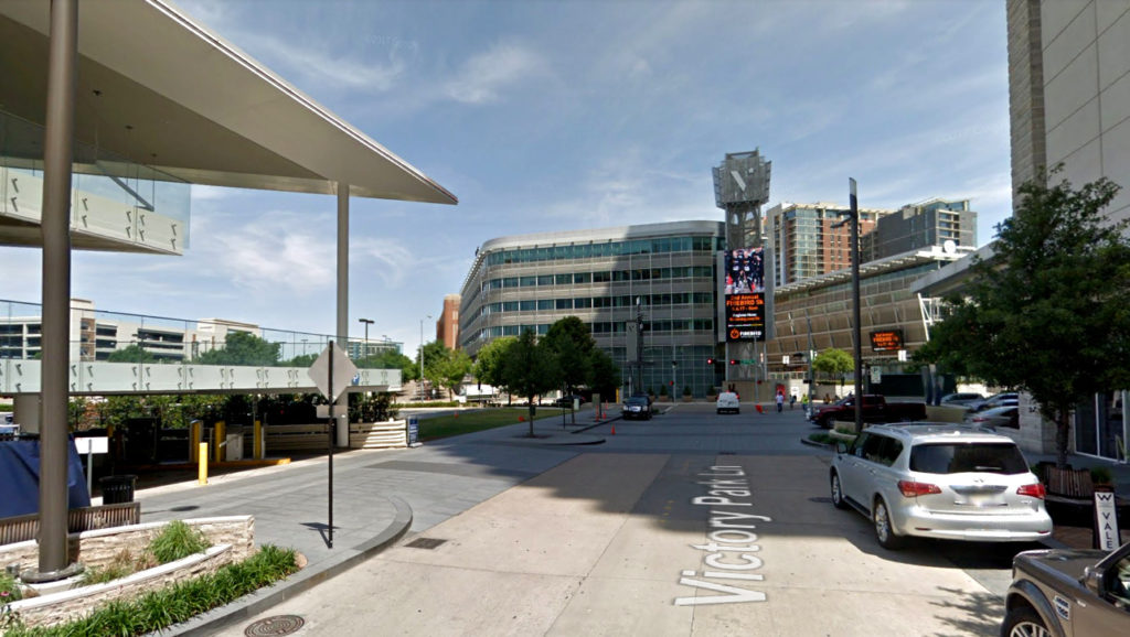 American Airlines Center looking north from Victory Park Lane. the new tower would occupy the surface parking lot to the left. Image: Google Maps.